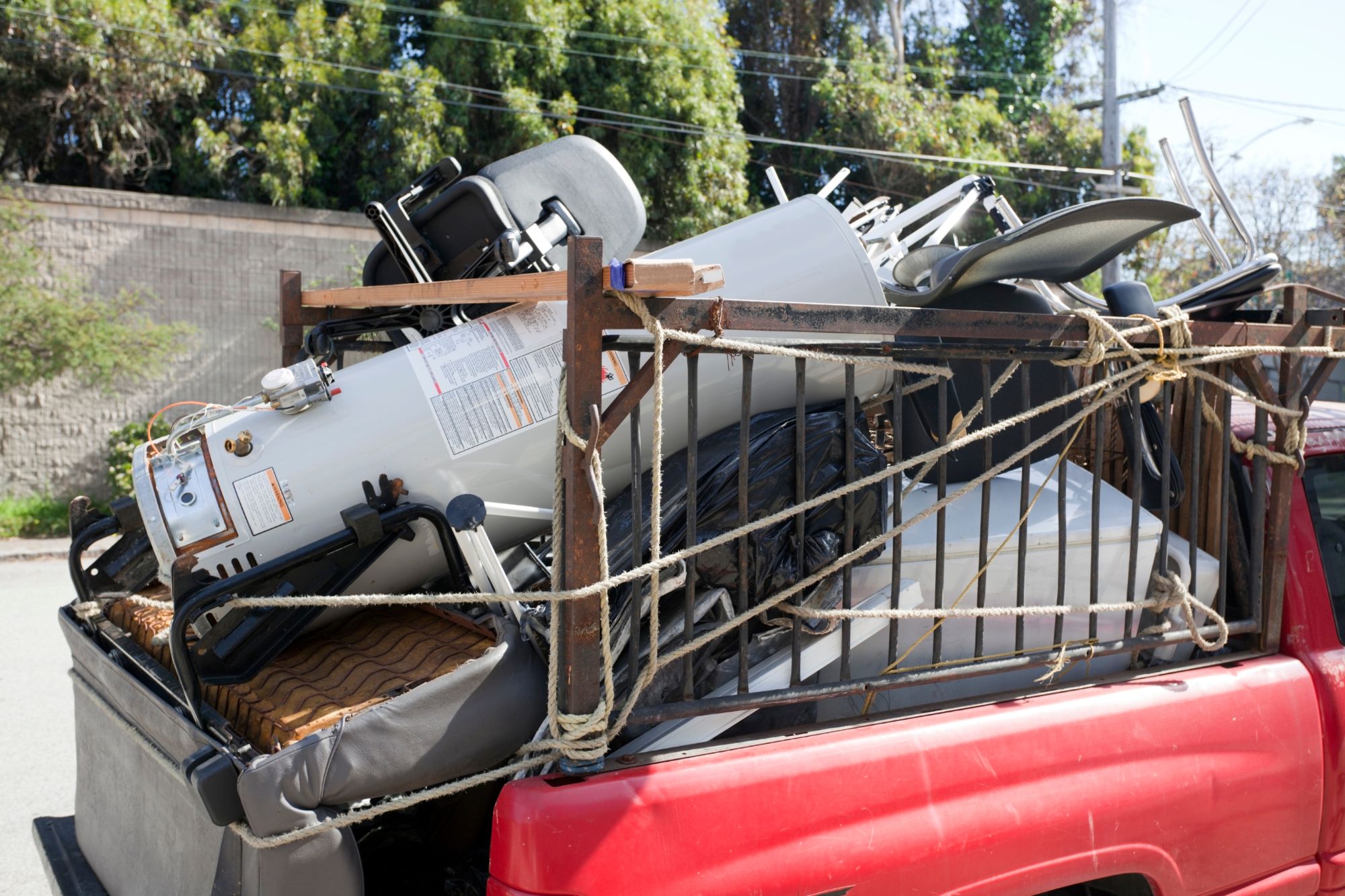A red truck overflowing with junk, highlighting a specialized junk removal service in Columbia, SC.
