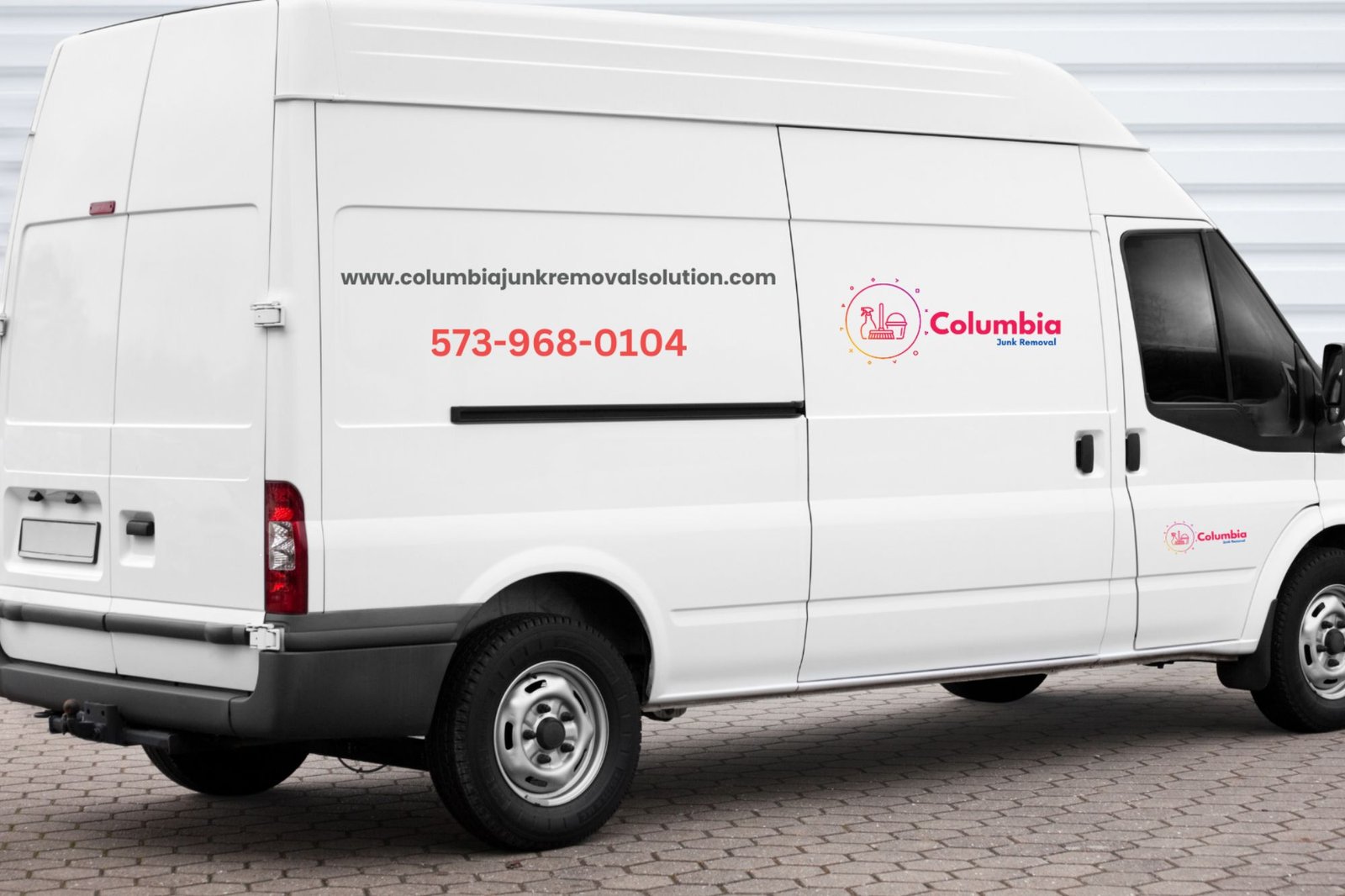 A white van featuring "Caribbean Catering," indicating its role in junk removal services in Columbia, SC.